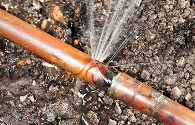 copper water pipe spraying water