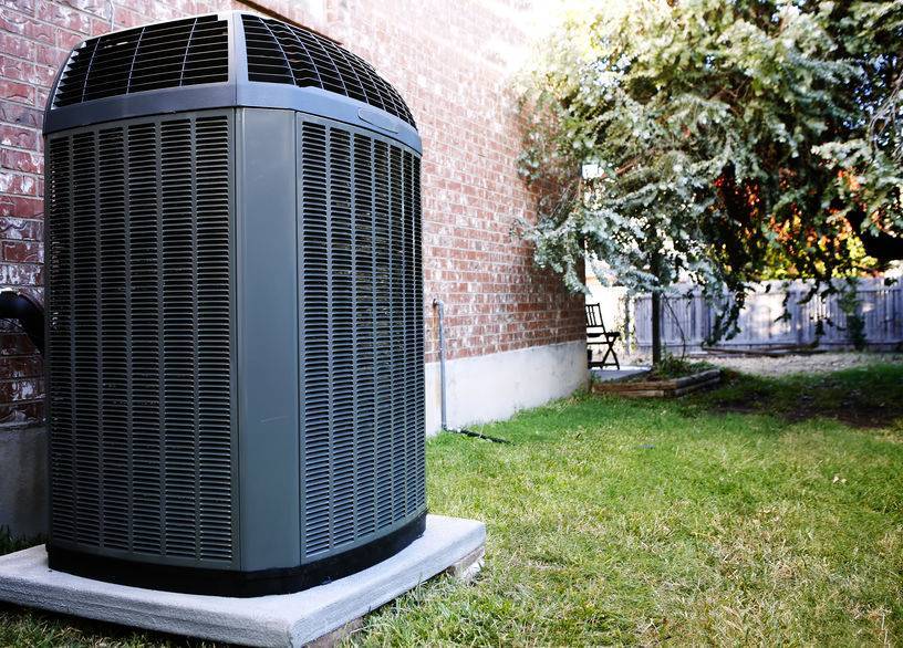 An image of a new AC unit outdoors.